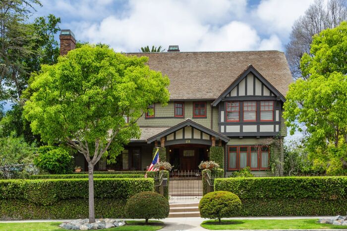 A large historic house surrounded by greenery, a spooky destination popular for Halloween visits.