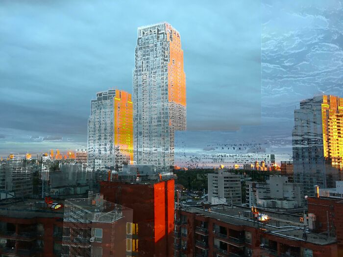 City skyline reflecting sunset colors on glass buildings, showcasing interesting pics that answer unexpected questions.