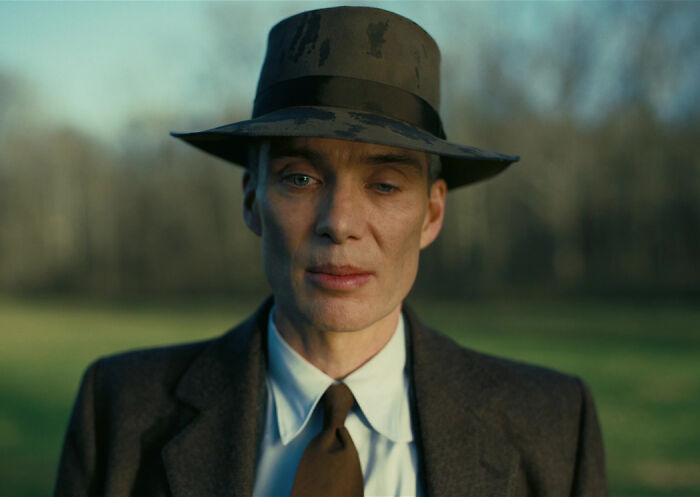 Actor wearing vintage suit and hat in outdoor scene representing 2024 pop culture moments that caught you off guard.