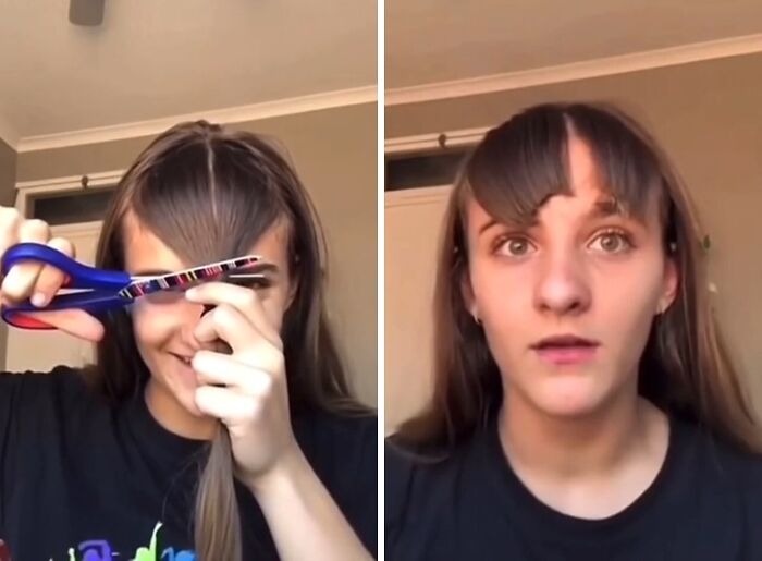 Woman cutting her own hair with scissors resulting in a hilariously tragic hair accident and uneven bangs.