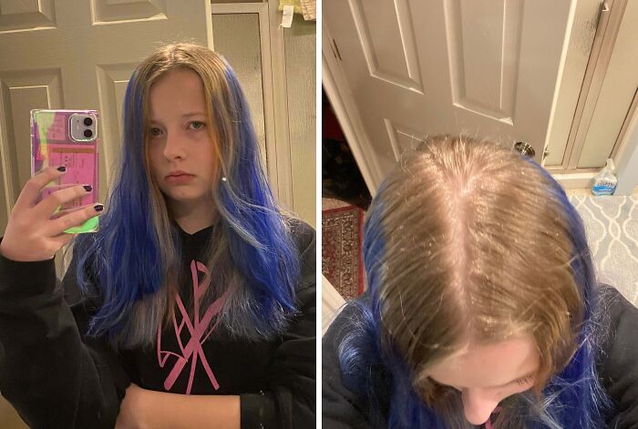 Young woman with unevenly dyed blue hair taking a mirror selfie, showing a hair coloring accident from above.