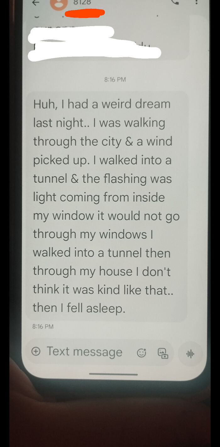 Text message describing a weird dream involving walking through a city, a tunnel, and unexplained flashing light.