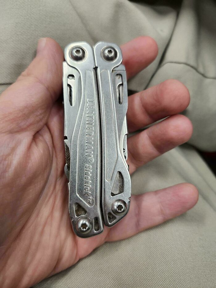 Hand holding a Leatherman multitool, showcasing its compact and durable design from an interesting group collection.