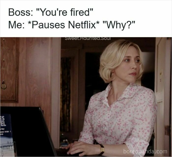 Woman pausing Netflix on laptop after being told You're fired, reflecting the humor in getting laid off memes.