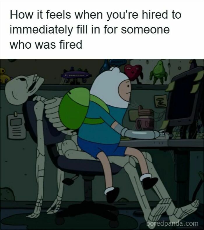 Cartoon character sitting at a computer with a skeleton behind, illustrating feelings about getting laid off at work.