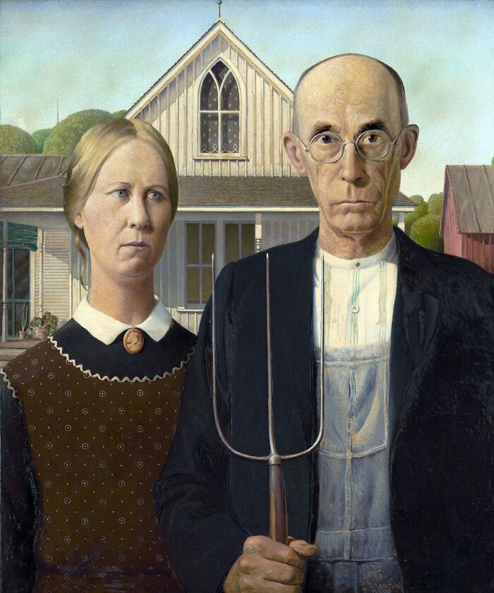 American Gothic painting showing a stern farmer couple in front of a rural house, famous painting that changed art forever.