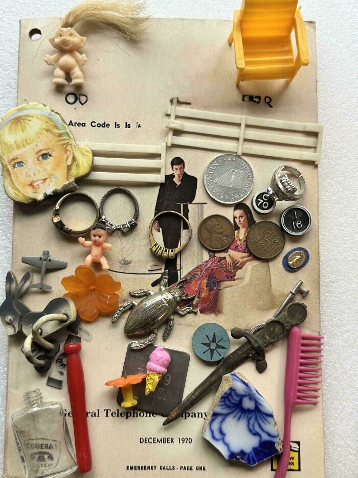 Collection of vintage trinkets, coins, and toys arranged on a nostalgic old home-themed backdrop from December 1970.