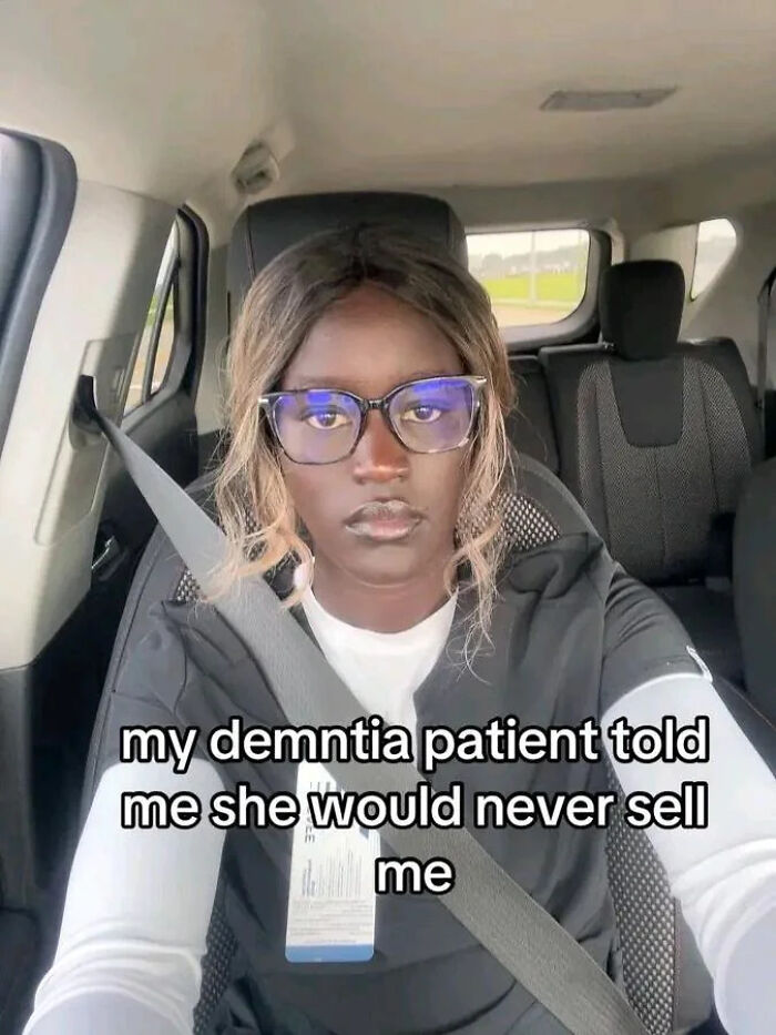 Woman wearing glasses and medical scrubs in car, sharing a post that goes from 0 to 100 real quick.