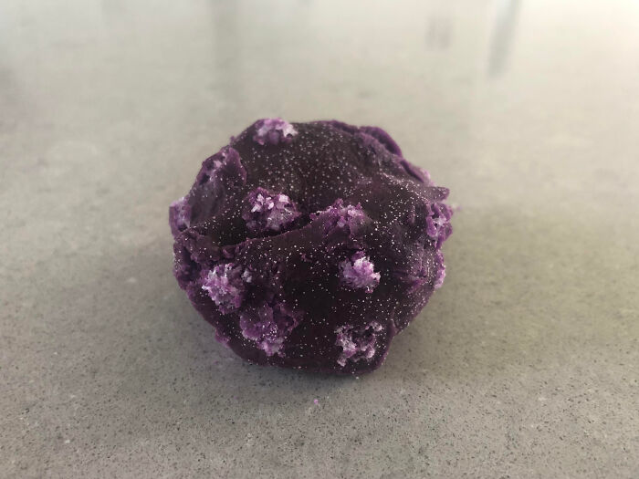 Close-up of a purple textured object with crystalline formations, an interesting pic that answers curious questions.