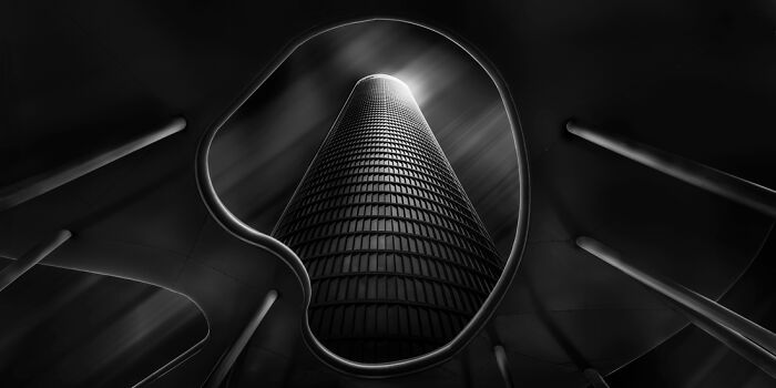 Black and white panoramic masterpiece of a futuristic skyscraper framed by abstract architectural curves under dramatic lighting.