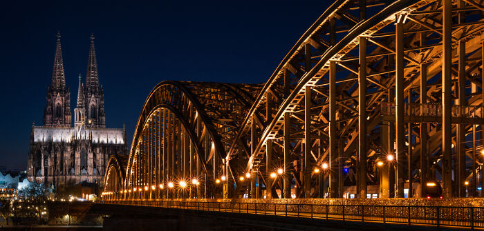 Night panoramic view of a lit bridge with cathedral in background, showcasing an award-winning Epson Pano Awards 2025 masterpiece.