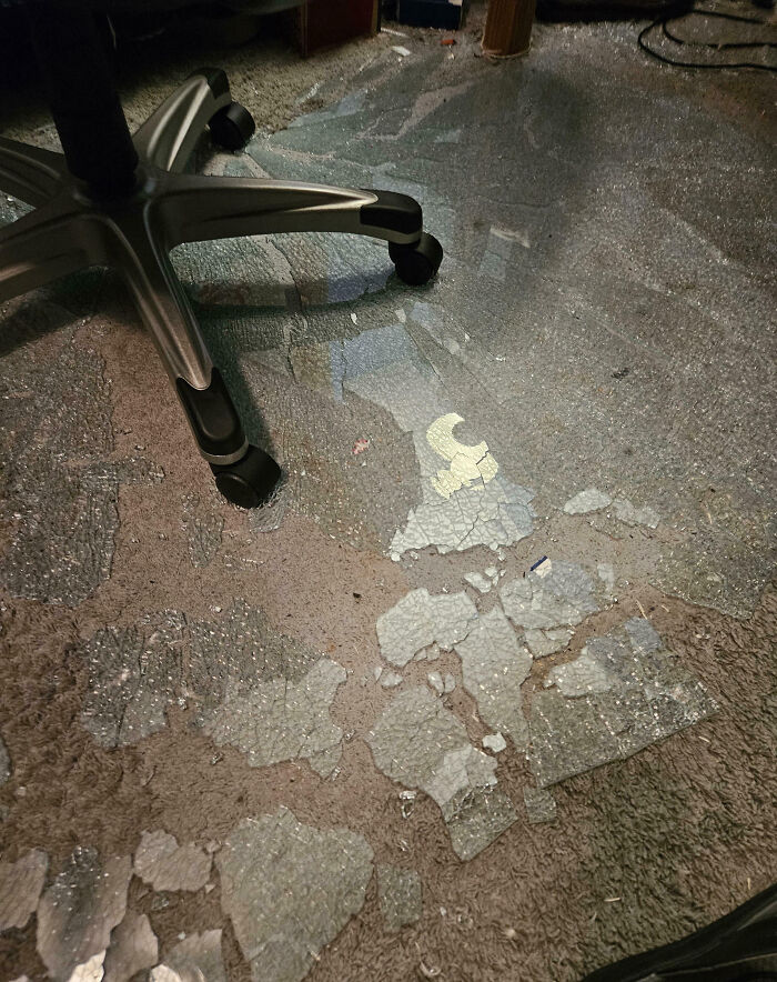 Worn and c*****d flooring beneath office chair wheels showing a total mess and signs it can always get worse