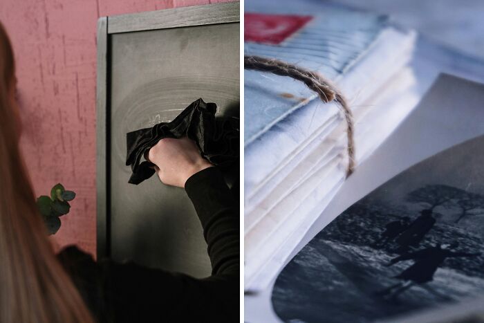 Person cleaning a chalkboard with a cloth next to a bundled stack of vintage photographs, highlighting luck and happiness choices.