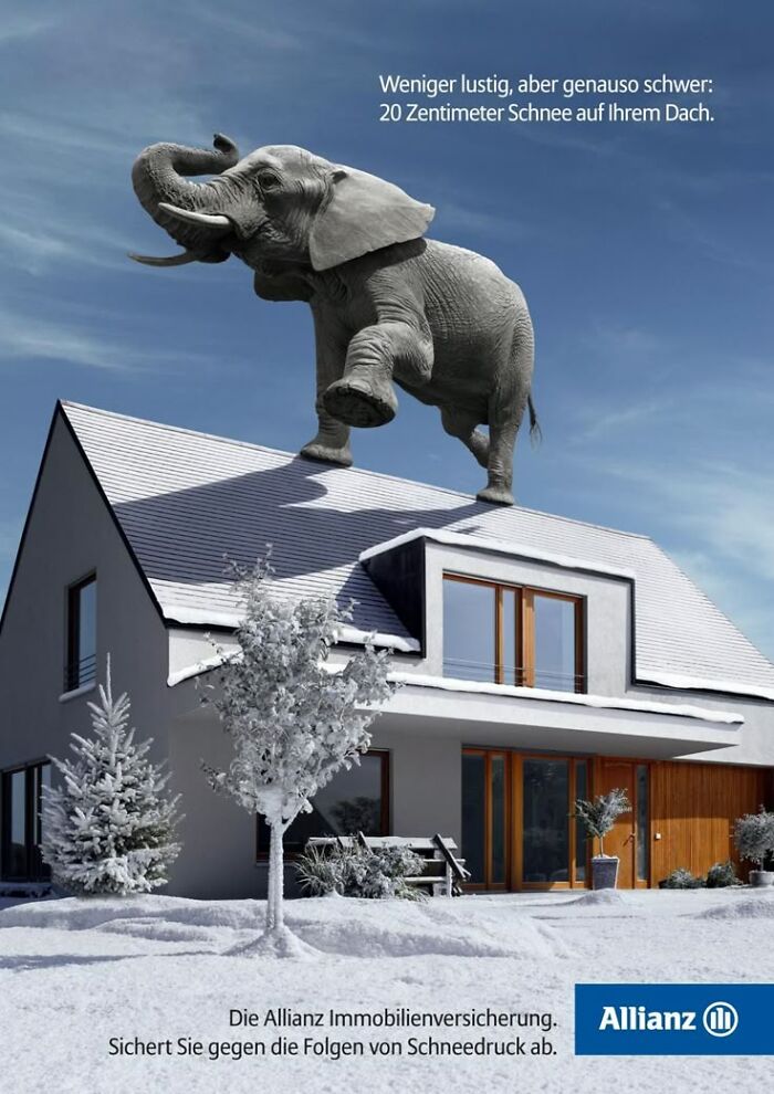 Elephant standing on a snowy roof in a creative ad campaign featuring elephants for insurance protection.