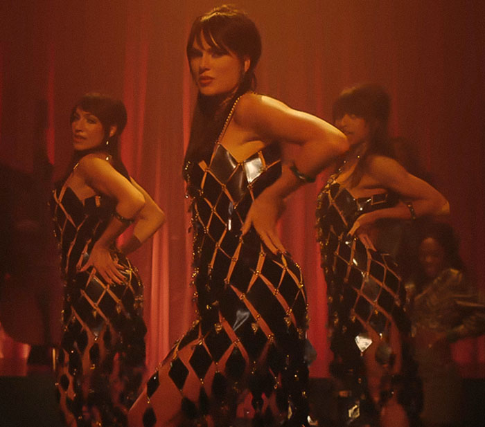 Taylor Swift performing with backup dancers in a music video hinting a secret jab at her ex.