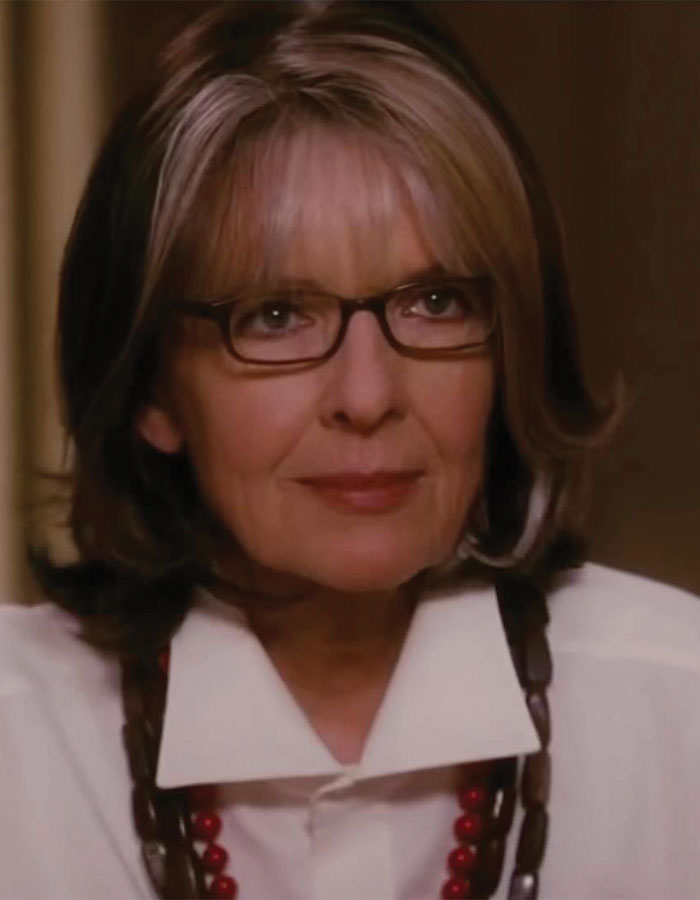 Diane Keaton wearing glasses and a white shirt, reflecting on her health decline while trying to sell her $28M home.