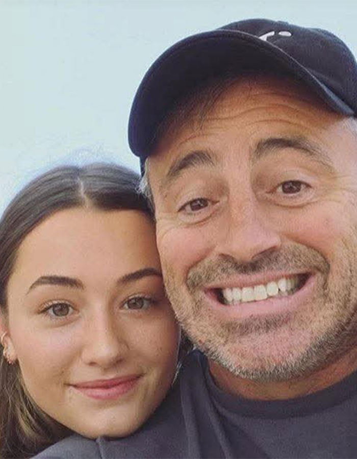 Joe Rogan smiling in a casual selfie with a young woman, linked to Matt LeBlanc reappearing as Joey news.