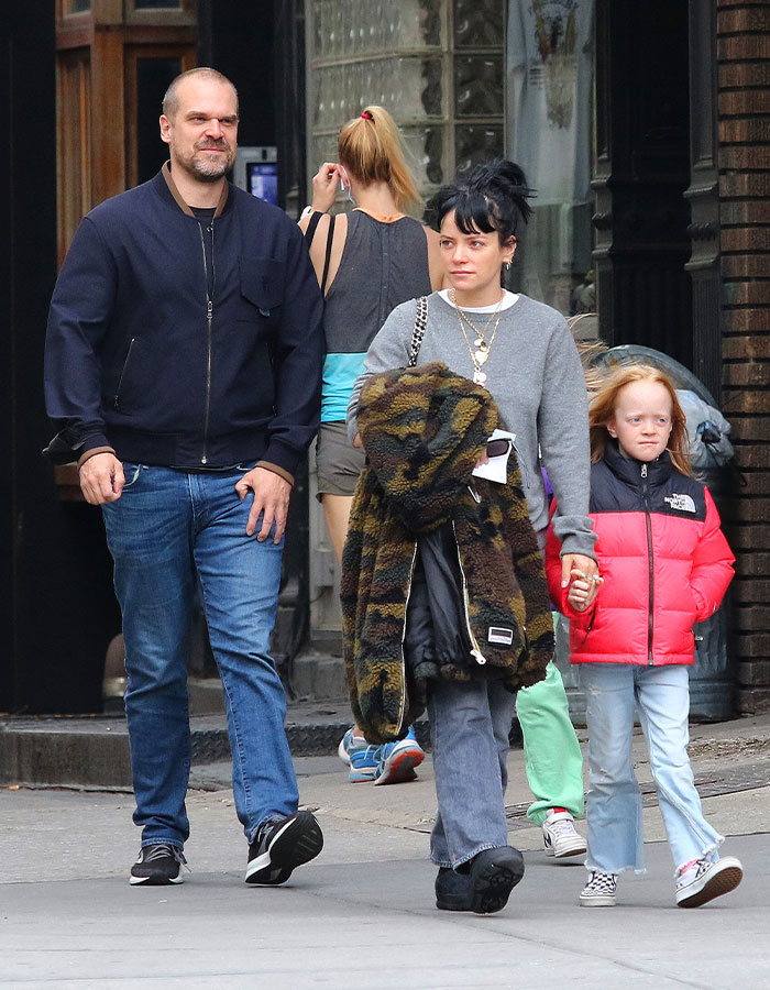 Lily Allen walking with family in casual clothes, highlighting her explosive new album and David Harbour cheating claims.