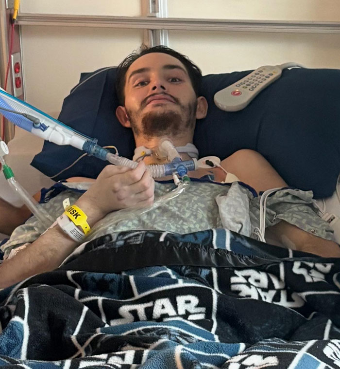 Florida dad-to-be in hospital bed with medical tubes, showing signs of waking from coma during recovery. Florida dad-to-be in hospital bed with medical tubes, showing signs of waking from coma during recovery.