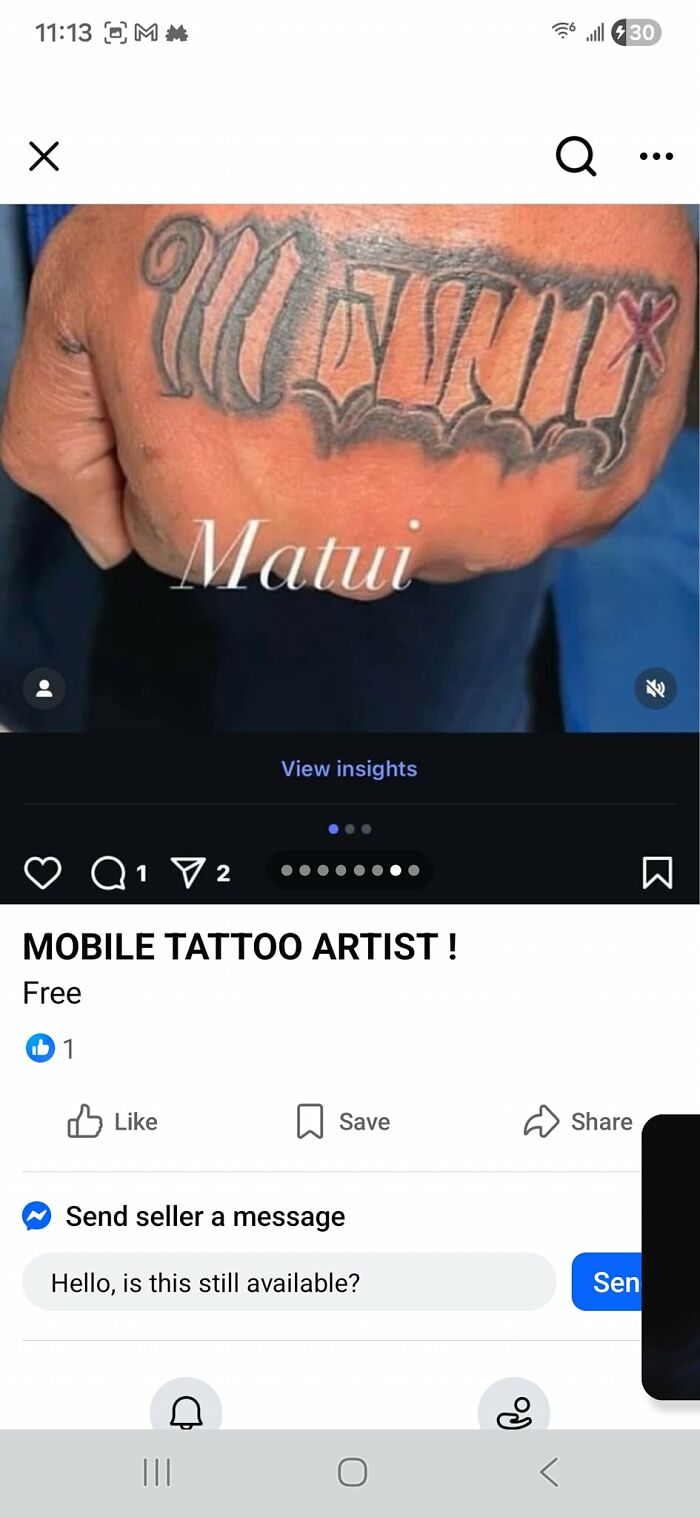 Close-up of a hand tattoo with stylized lettering, showcasing unusual tattoo designs people allowed on their bodies.