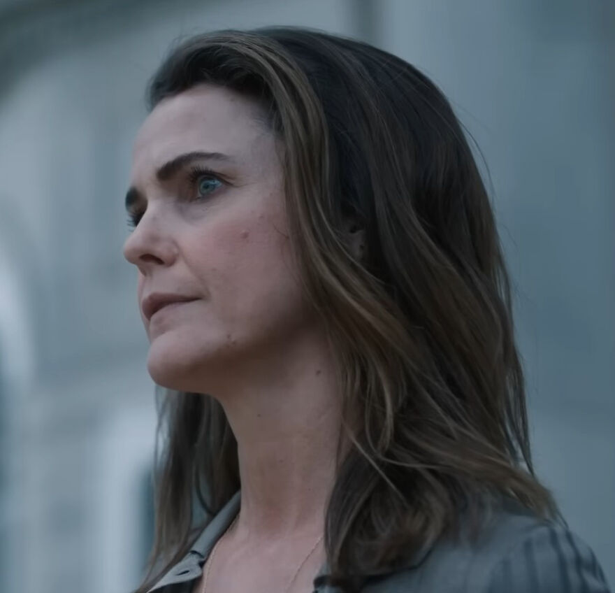 Keri Russell looking thoughtful outdoors, addressing Hollywood's growing plastic surgery trend as a woman at 49.