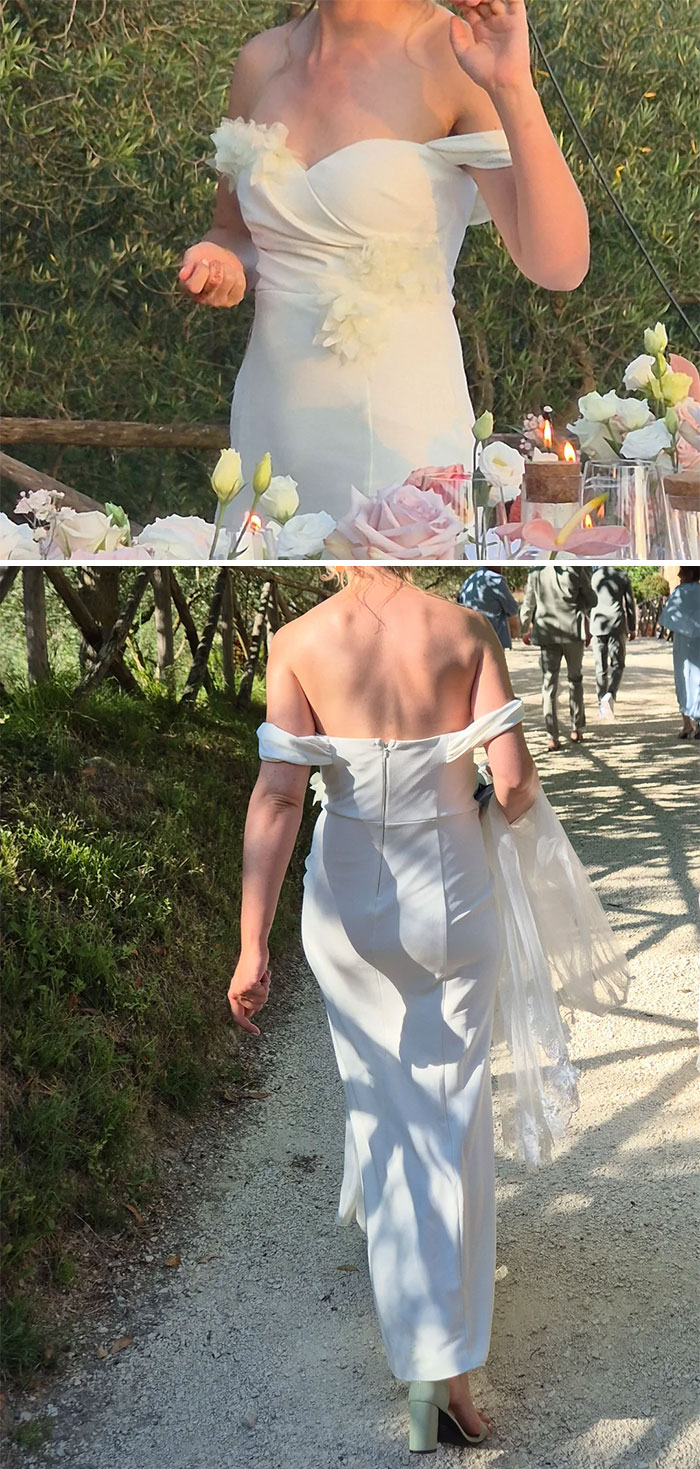 Bride in an off-shoulder white wedding dress with floral details, walking outdoors during a wedding event.