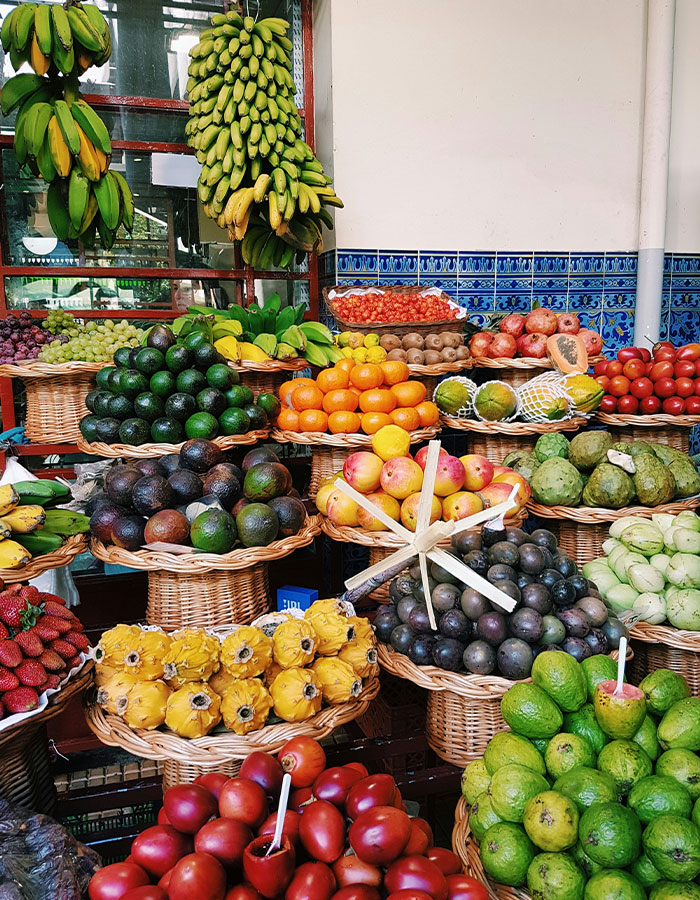Colorful display of fresh fruits at a market emphasizing vegan lifestyle and raw diet choices. Colorful display of fresh fruits at a market emphasizing vegan lifestyle and raw diet choices.