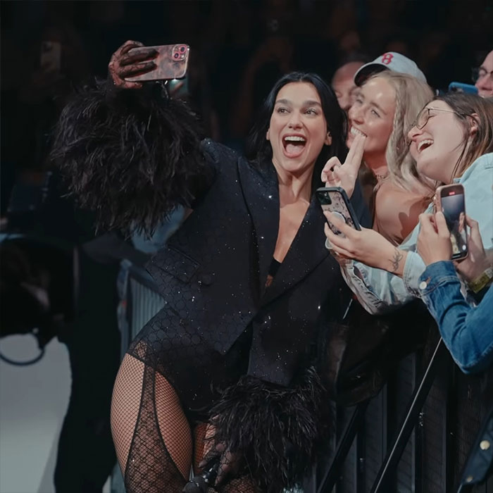 Dua Lipa posing for selfies with fans during a concert amid massive outrage over inappropriate touching incident. Dua Lipa posing for selfies with fans during a concert amid massive outrage over inappropriate touching incident.