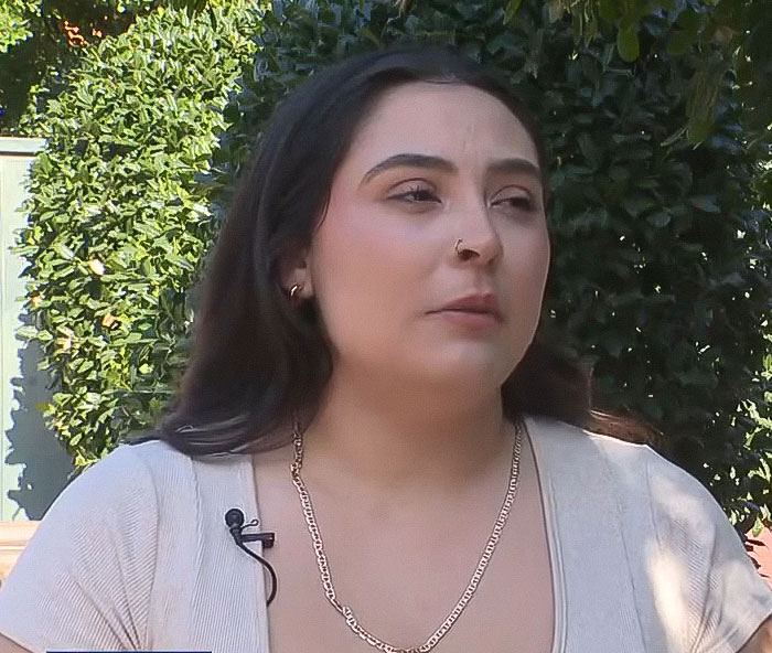 Woman speaking outside pet store, sharing details about argument that led to tragic loss of life incident.