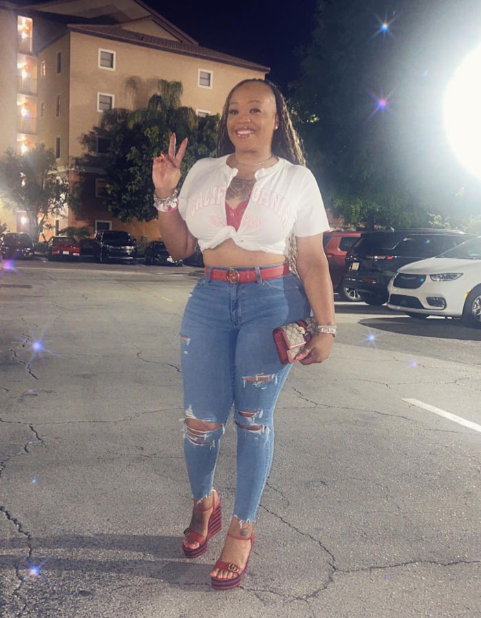 Woman posing in ripped jeans and white shirt at night, linked to unhinged act after breaking into boyfriend&rsquo;s home incident.