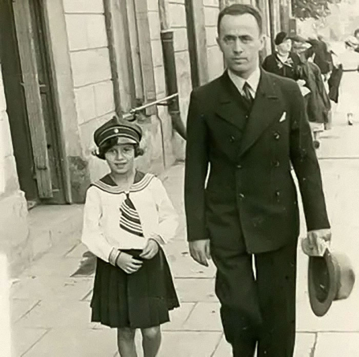 Holocaust survivor Ruth Posner and husband walking on a street in historical black and white photograph.