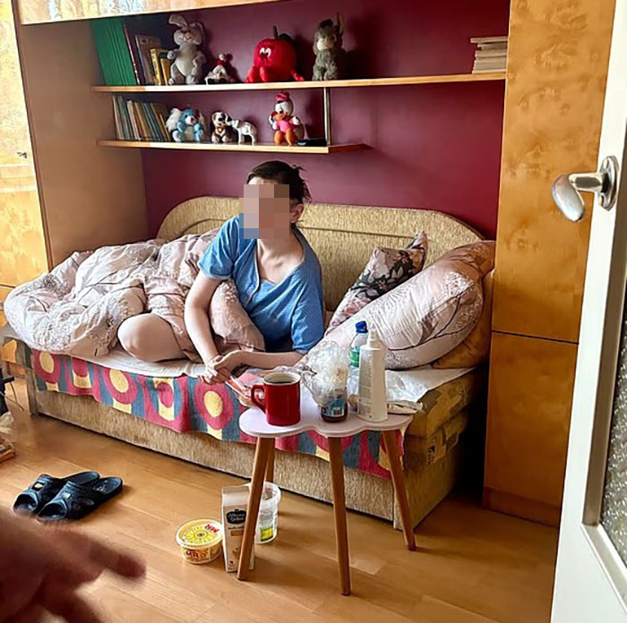 Teen missing 27 years found living in parents&rsquo; house in distressing and neglected condition on a cluttered couch.