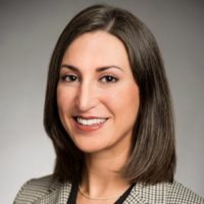 Portrait of a woman with shoulder-length brown hair smiling, related to major twist in case of mom who left 6-month-old baby.