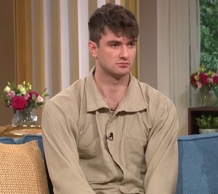 Young man seated on a couch during a discussion on coroner exposing mom influencing daughter to refuse chemo treatment. Young man seated on a couch during a discussion on coroner exposing mom influencing daughter to refuse chemo treatment.