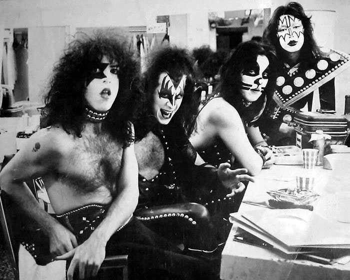 Kiss band members Gene Simmons and Paul Stanley backstage in full stage makeup and costumes.