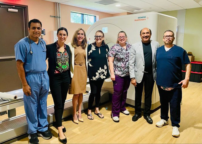 Group of medical professionals standing in a clinical room, connected to a major twist in case of mom who left baby alone on beach.