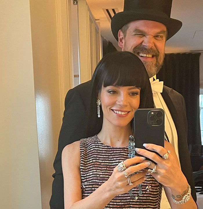 David Harbour and Lily Allen taking a selfie together, sparking fans clash online over cheating controversy.