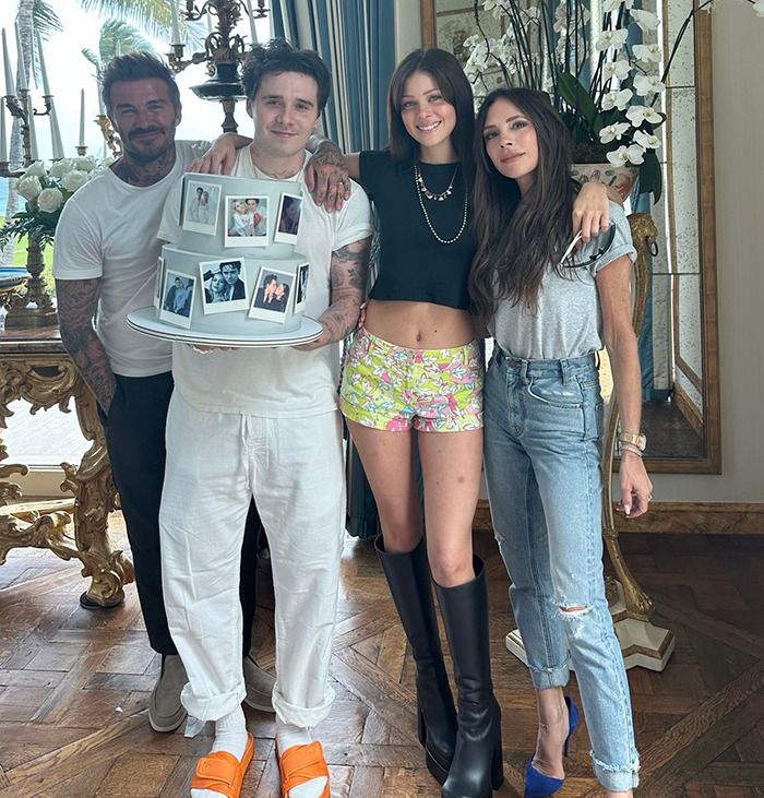 Victoria Beckham with Brooklyn and Nicola Peltz posing indoors, highlighting rumored family feud and shade between them.