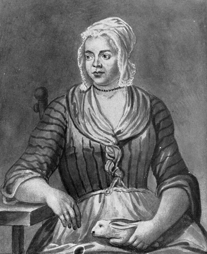 Black and white portrait of a historical woman holding a rabbit, illustrating events from history that will never not be funny.