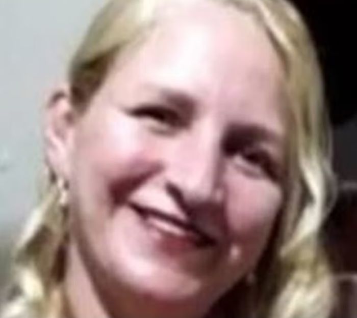 Close-up of a smiling blonde woman with an angel-faced serial criminal's chilling confession mentioned in the background.