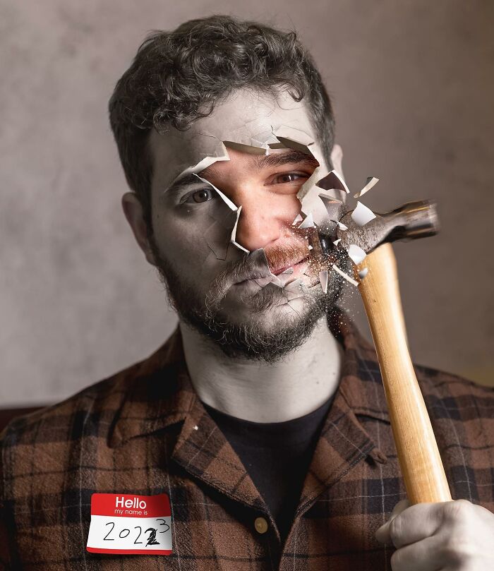 Man holding hammer with face photo manipulation showing shattering effect, showcasing amazing logic-challenging photo manipulations.