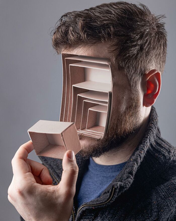 Man with a logic-challenging photo manipulation showing a recursive box pattern replacing part of his face.