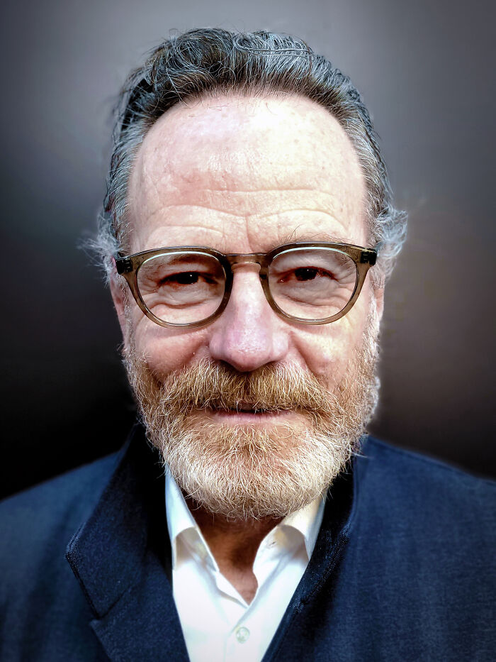 Male Hollywood actor with glasses and beard smiling, representing stars who found fame after 30 in the entertainment industry.