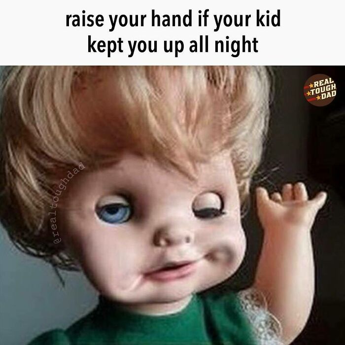 Tired doll raising hand humorously representing relatable parenting memes about sleepless nights with kids.