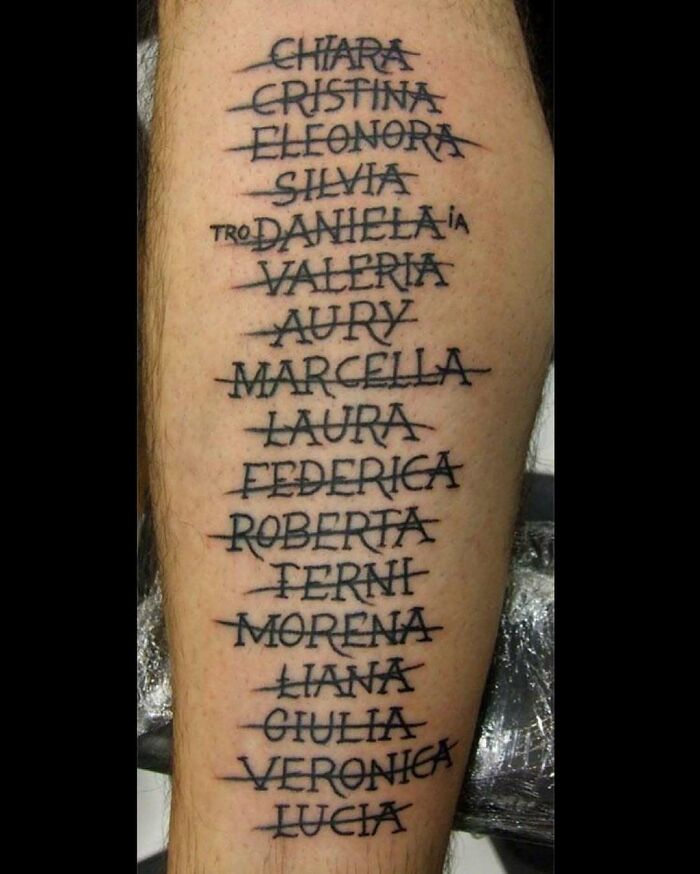 Tattoo on leg with multiple female names crossed out, illustrating awful tattoos and poor decisions.