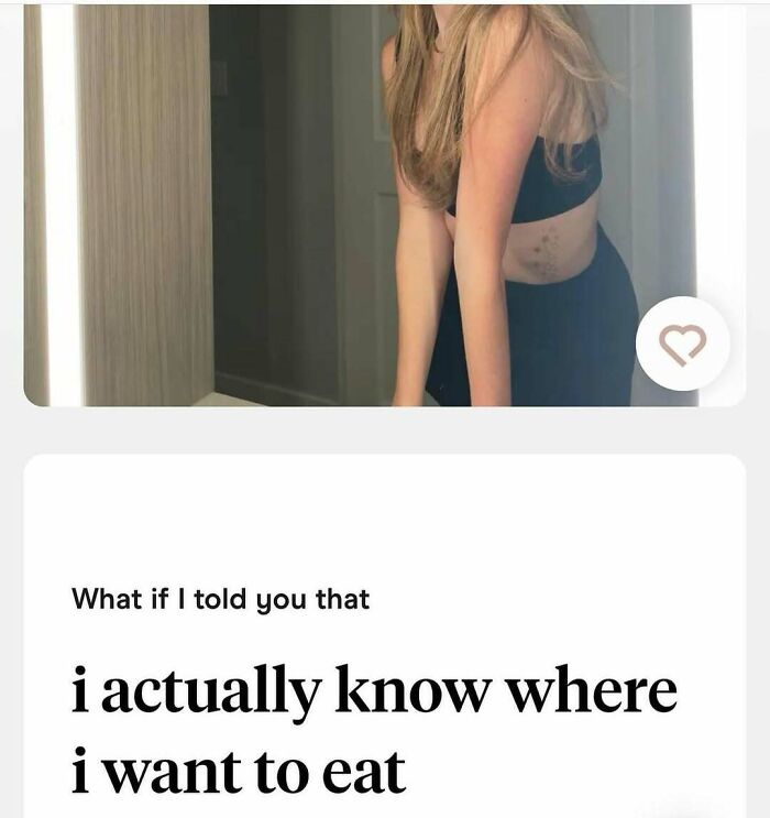 Woman in black outfit posing by mirror, paired with a dating app message about knowing where to eat, highlighting unhinged dating app moments.