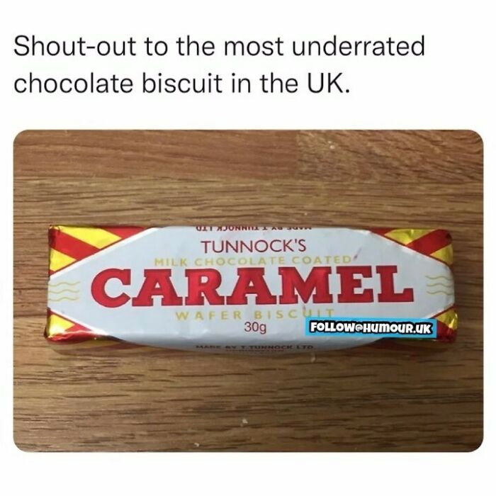 Underrated British chocolate biscuit Tunnock's Caramel on wooden table, classic UK snack loved in memes and posts.