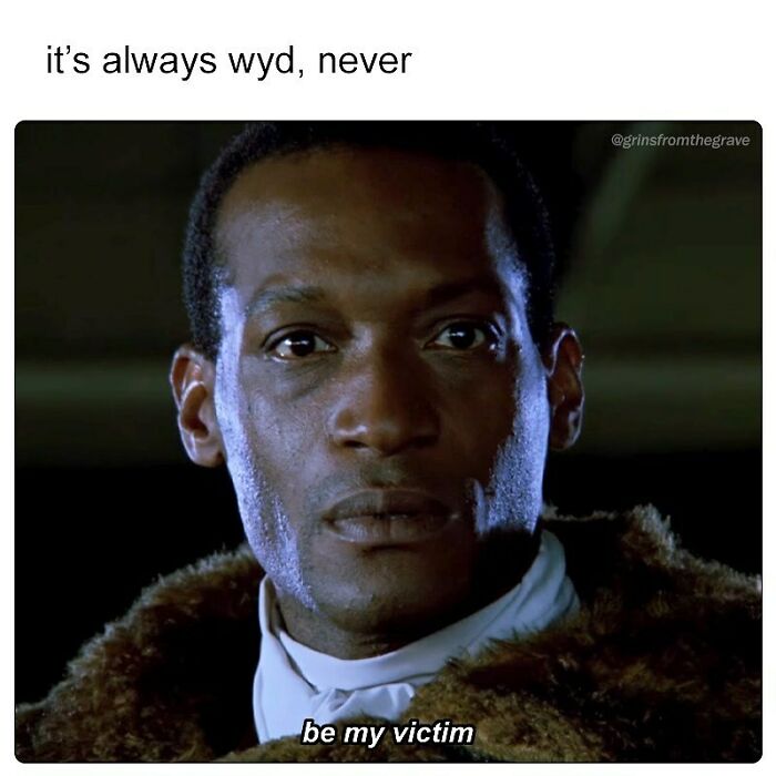 Close-up of a serious man in vintage clothing with a horror movie meme caption about being a victim.