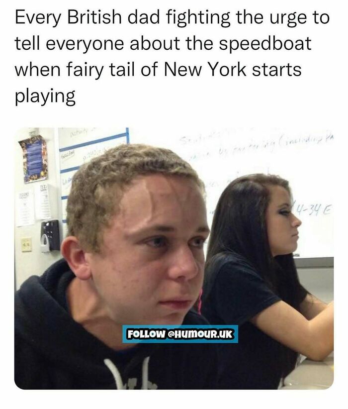 A young man straining to hold back while a teenage girl sits unfazed in a classroom meme about British humor.