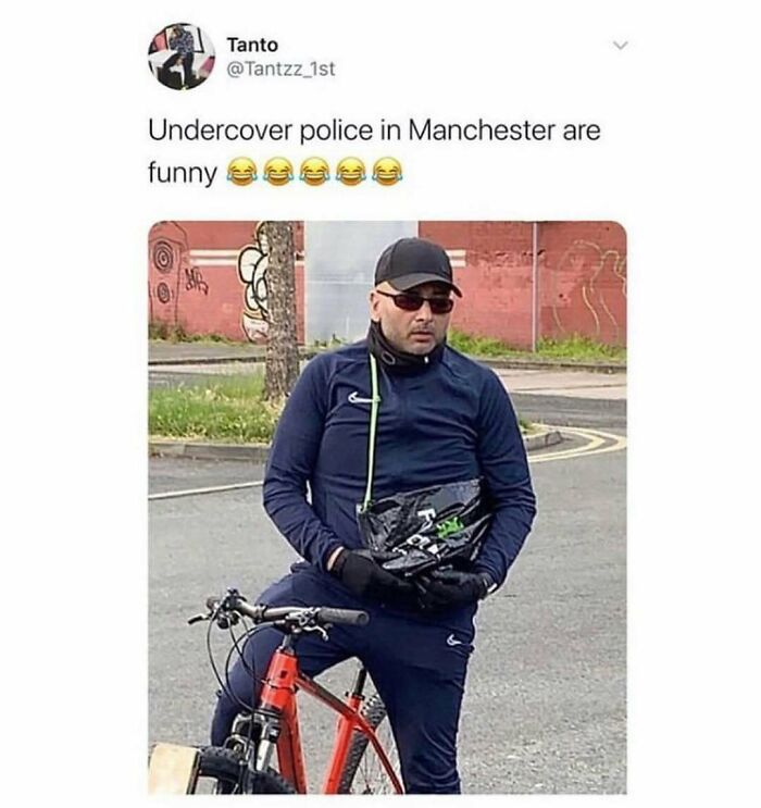 Man in casual wear and sunglasses holding a bag while sitting on a bike, British memes capturing humor on undercover police.